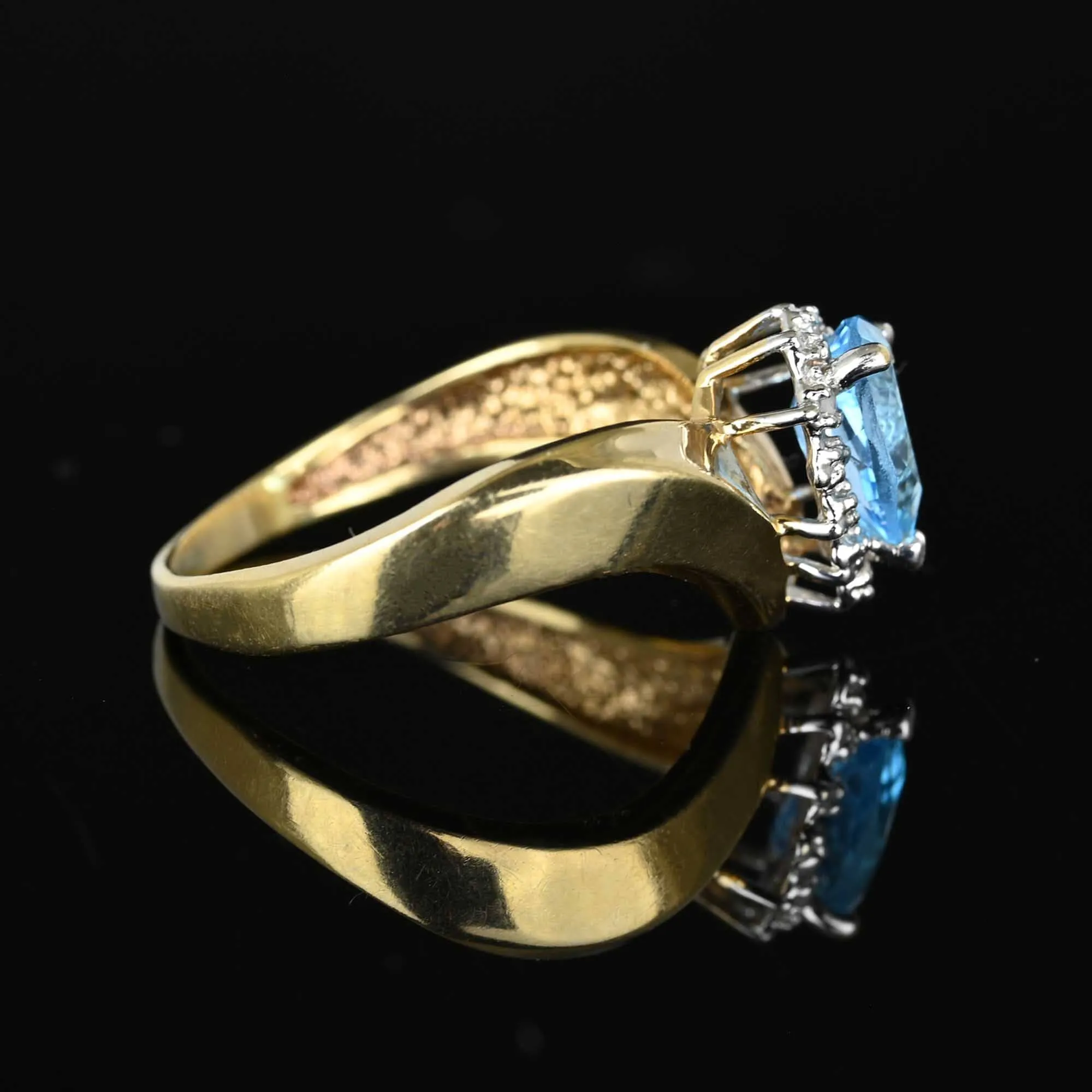 Diamond Halo Pear Cut Blue Topaz Ring in Gold